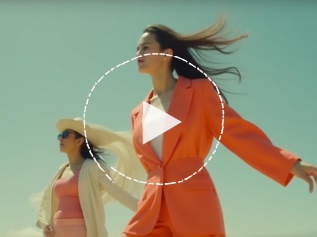 Thumbnail for a fashion video, showing a dynamic pose with a play icon overlay.